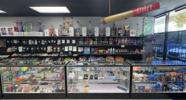 Inside Inhale Exhale Smoke — Jacksonville storefront counter and product wall